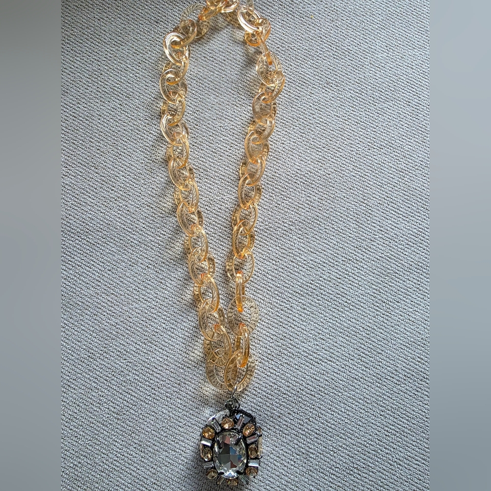Acrylic necklace with jeweled pendant